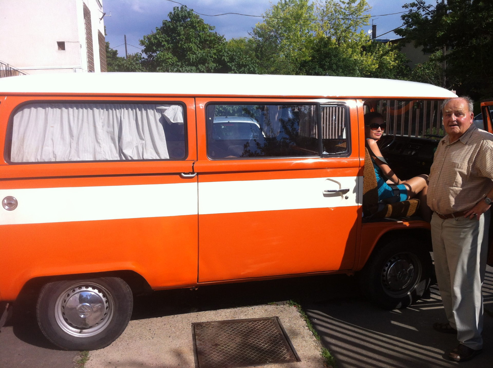 My 1976 Volkswagen T2 with family members at the side door