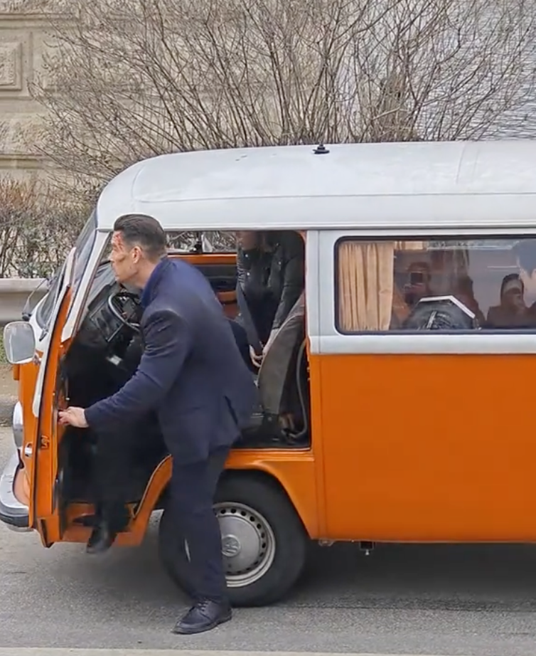 John Cena entering the orange VW T2 during filming in Budapest