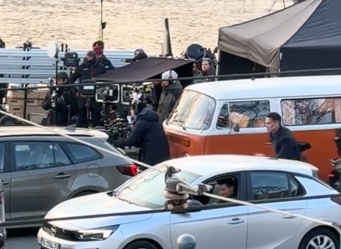 John Cena on the Budapest set with the orange VW T2 and filming crew