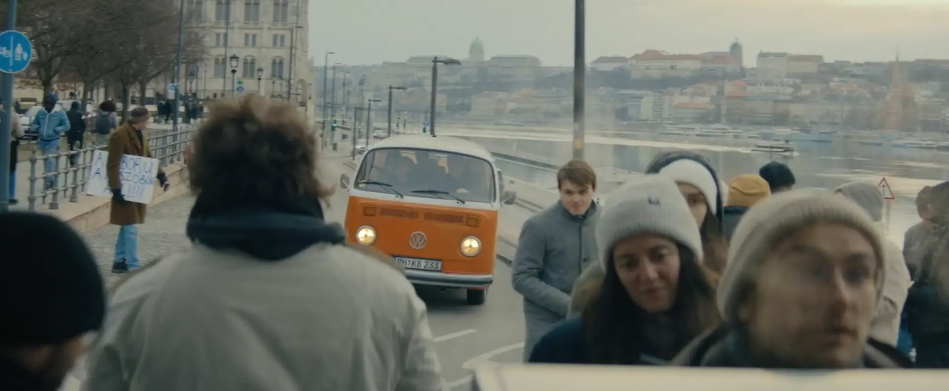 The orange VW T2 approaching through a crowd on the Budapest Danube embankment