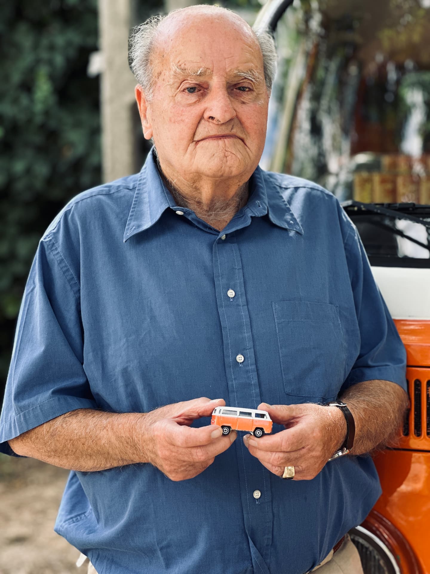 Mr. Thaly, the original owner, holding the Matchbox model of the 1976 VW T2