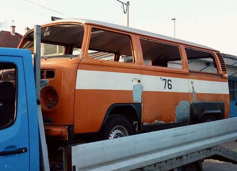 The 1976 Volkswagen T2 on a flatbed during earlier bodywork and restoration preparations